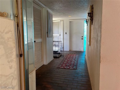 Opportunity Knocks! This 2BR/2BA single-story home in San Carlos on San Carlos Golf Club in Florida - for sale on GolfHomes.com, golf home, golf lot