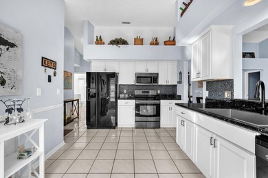 Beautifully maintained home located in a man-gated, golf course on Atlantic National Golf and Country Club in Florida - for sale on GolfHomes.com, golf home, golf lot