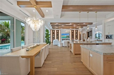 Enjoy sweeping southern exposure and serene golf course views on The Moorings Country Club in Florida - for sale on GolfHomes.com, golf home, golf lot