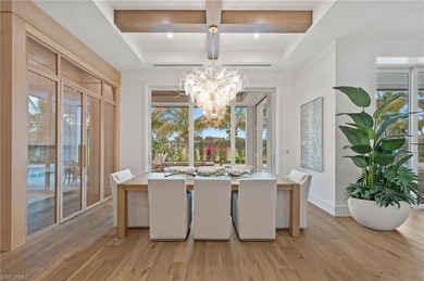 Enjoy sweeping southern exposure and serene golf course views on The Moorings Country Club in Florida - for sale on GolfHomes.com, golf home, golf lot