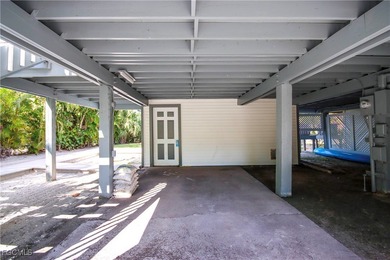 The perfect island retreat! Enjoy beautiful lake views from this on The Dunes Golf and Tennis Club in Florida - for sale on GolfHomes.com, golf home, golf lot