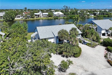 The perfect island retreat! Enjoy beautiful lake views from this on The Dunes Golf and Tennis Club in Florida - for sale on GolfHomes.com, golf home, golf lot