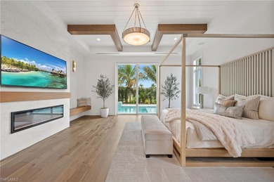 Enjoy sweeping southern exposure and serene golf course views on The Moorings Country Club in Florida - for sale on GolfHomes.com, golf home, golf lot