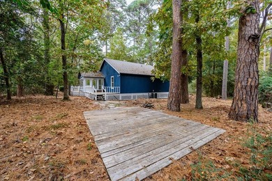 Move-in ready, furnished retreat nestled among the tall pines of on Holly Lake Ranch Golf Club in Texas - for sale on GolfHomes.com, golf home, golf lot