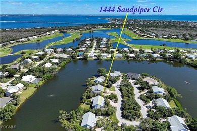 The perfect island retreat! Enjoy beautiful lake views from this on The Dunes Golf and Tennis Club in Florida - for sale on GolfHomes.com, golf home, golf lot