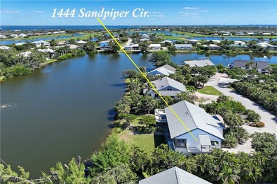 The perfect island retreat! Enjoy beautiful lake views from this on The Dunes Golf and Tennis Club in Florida - for sale on GolfHomes.com, golf home, golf lot