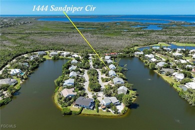 The perfect island retreat! Enjoy beautiful lake views from this on The Dunes Golf and Tennis Club in Florida - for sale on GolfHomes.com, golf home, golf lot