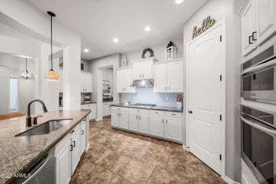 Welcome to this stunning 5 + 1 bedroom, 3-bathroom home nestled on Verrado Golf Club  in Arizona - for sale on GolfHomes.com, golf home, golf lot