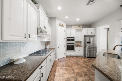 Welcome to this stunning 5 + 1 bedroom, 3-bathroom home nestled on Verrado Golf Club  in Arizona - for sale on GolfHomes.com, golf home, golf lot