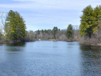 Enjoy the spectacular direct pond views from this ranch End Unit on Farmington Woods Country Club in Connecticut - for sale on GolfHomes.com, golf home, golf lot