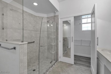 This gorgeous lower level coach home is a must-see property in on Verandah Golf Course and Club in Florida - for sale on GolfHomes.com, golf home, golf lot
