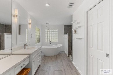 Spacious 3-bed, 3-bath home with two master suites--perfect for on Harlingen Country Club in Texas - for sale on GolfHomes.com, golf home, golf lot