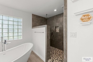 Spacious 3-bed, 3-bath home with two master suites--perfect for on Harlingen Country Club in Texas - for sale on GolfHomes.com, golf home, golf lot