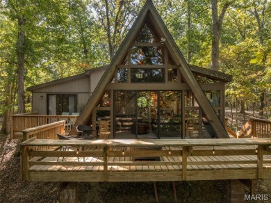 This cozy chalet offers the classic A-frame design with a on Innsbrook Resort Golf Course in Missouri - for sale on GolfHomes.com, golf home, golf lot