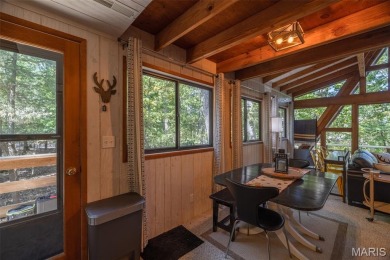 This cozy chalet offers the classic A-frame design with a on Innsbrook Resort Golf Course in Missouri - for sale on GolfHomes.com, golf home, golf lot