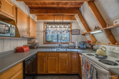 This cozy chalet offers the classic A-frame design with a on Innsbrook Resort Golf Course in Missouri - for sale on GolfHomes.com, golf home, golf lot