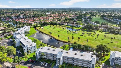 Bright and Stunning Corner unit with lake & Golf views, located on Oriole Golf and Tennis Club in Florida - for sale on GolfHomes.com, golf home, golf lot