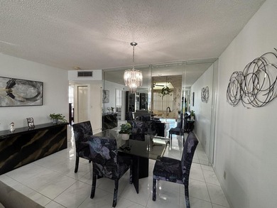 Bright and Stunning Corner unit with lake & Golf views, located on Oriole Golf and Tennis Club in Florida - for sale on GolfHomes.com, golf home, golf lot