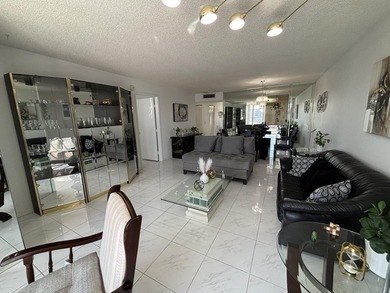 Bright and Stunning Corner unit with lake & Golf views, located on Oriole Golf and Tennis Club in Florida - for sale on GolfHomes.com, golf home, golf lot