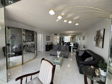 Bright and Stunning Corner unit with lake & Golf views, located on Oriole Golf and Tennis Club in Florida - for sale on GolfHomes.com, golf home, golf lot