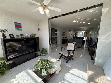 Bright and Stunning Corner unit with lake & Golf views, located on Oriole Golf and Tennis Club in Florida - for sale on GolfHomes.com, golf home, golf lot