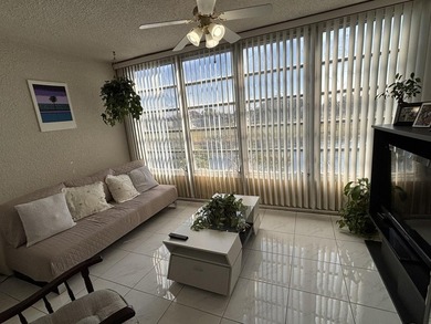 Bright and Stunning Corner unit with lake & Golf views, located on Oriole Golf and Tennis Club in Florida - for sale on GolfHomes.com, golf home, golf lot