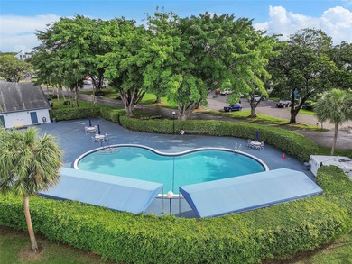 Bright and Stunning Corner unit with lake & Golf views, located on Oriole Golf and Tennis Club in Florida - for sale on GolfHomes.com, golf home, golf lot