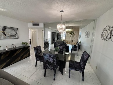 Bright and Stunning Corner unit with lake & Golf views, located on Oriole Golf and Tennis Club in Florida - for sale on GolfHomes.com, golf home, golf lot