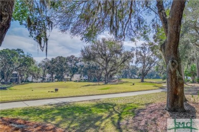 Situated on a beautiful lot overlooking a lagoon and the 17th on The Landings Club - Palmetto in Georgia - for sale on GolfHomes.com, golf home, golf lot