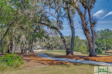 Situated on a beautiful lot overlooking a lagoon and the 17th on The Landings Club - Palmetto in Georgia - for sale on GolfHomes.com, golf home, golf lot