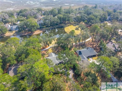 Situated on a beautiful lot overlooking a lagoon and the 17th on The Landings Club - Palmetto in Georgia - for sale on GolfHomes.com, golf home, golf lot