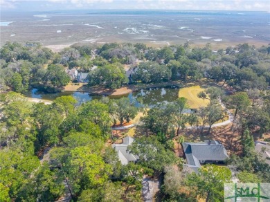 Situated on a beautiful lot overlooking a lagoon and the 17th on The Landings Club - Palmetto in Georgia - for sale on GolfHomes.com, golf home, golf lot