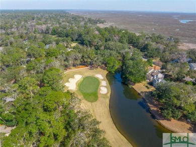 Situated on a beautiful lot overlooking a lagoon and the 17th on The Landings Club - Palmetto in Georgia - for sale on GolfHomes.com, golf home, golf lot