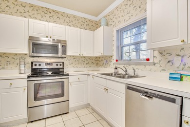 Welcome to your first-floor condo located in River Crossing at on Barefoot Resort and Golf Club  in South Carolina - for sale on GolfHomes.com, golf home, golf lot