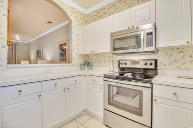 Welcome to your first-floor condo located in River Crossing at on Barefoot Resort and Golf Club  in South Carolina - for sale on GolfHomes.com, golf home, golf lot