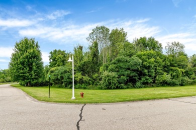 Discover the allure of lakeside living at Highfield Beach Club on South Haven Golf Club in Michigan - for sale on GolfHomes.com, golf home, golf lot