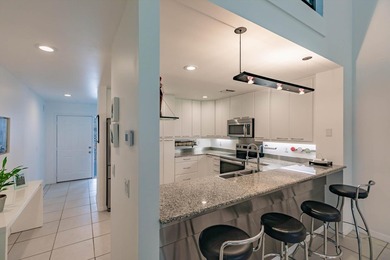 Fully renovated: modern kitchen with SS appliances and granite on Heritage Ridge Golf Club in Florida - for sale on GolfHomes.com, golf home, golf lot