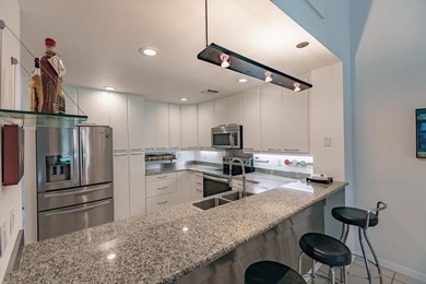 Fully renovated: modern kitchen with SS appliances and granite on Heritage Ridge Golf Club in Florida - for sale on GolfHomes.com, golf home, golf lot