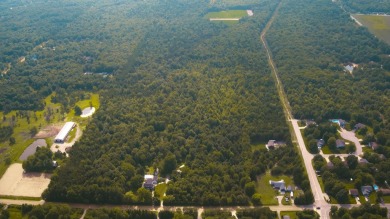 Discover your personal sanctuary within this sprawling 56.72 on Muskegon Country Club in Michigan - for sale on GolfHomes.com, golf home, golf lot