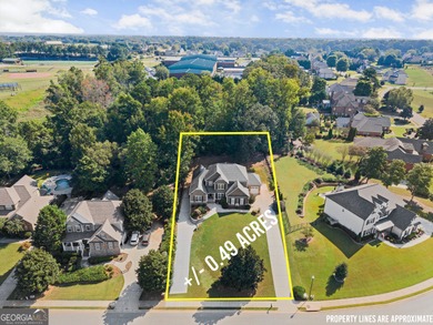 Welcome home to this stunning 5-bedroom, 3.5-bathroom gem on Traditions of Braselton Golf Club in Georgia - for sale on GolfHomes.com, golf home, golf lot