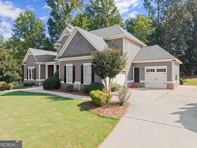 Welcome home to this stunning 5-bedroom, 3.5-bathroom gem on Traditions of Braselton Golf Club in Georgia - for sale on GolfHomes.com, golf home, golf lot