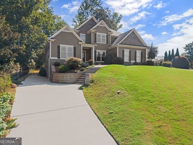 Welcome home to this stunning 5-bedroom, 3.5-bathroom gem on Traditions of Braselton Golf Club in Georgia - for sale on GolfHomes.com, golf home, golf lot