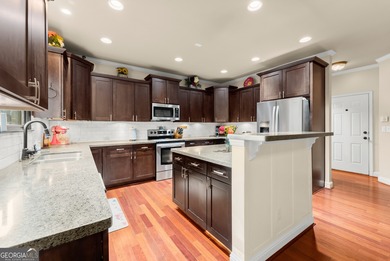 Welcome home to this stunning 5-bedroom, 3.5-bathroom gem on Traditions of Braselton Golf Club in Georgia - for sale on GolfHomes.com, golf home, golf lot