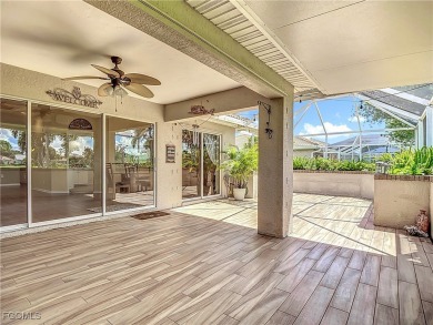 This well-maintained Villareal model home sits directly on the on Herons Glen Golf and Country Club in Florida - for sale on GolfHomes.com, golf home, golf lot