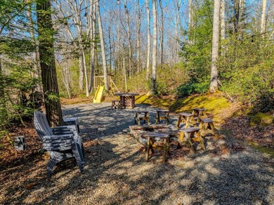 Welcome to Bear's Den, a beautiful Hearthstone LOG CABIN located on Alpine Lake Resort in West Virginia - for sale on GolfHomes.com, golf home, golf lot
