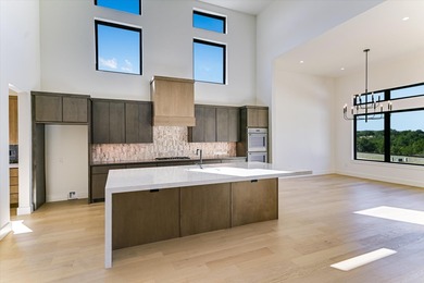 This newly constructed contemporary residence in Tuscan Village on Summit Rock Golf Course in Texas - for sale on GolfHomes.com, golf home, golf lot