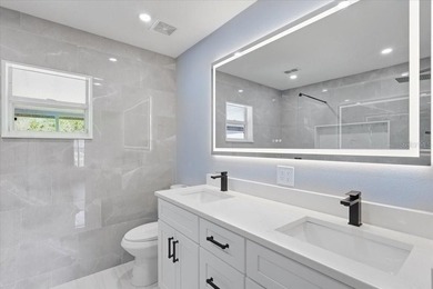 Better Than New and exceptionally upgraded, this stunning home on The Grand Club Cypress Course in Florida - for sale on GolfHomes.com, golf home, golf lot