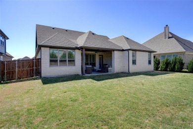 Experience resort-style living in this stunning 4-bedroom, 2 on The Golf Club at Resort Eagle Mountain Lake in Texas - for sale on GolfHomes.com, golf home, golf lot