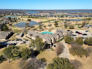 Experience resort-style living in this stunning 4-bedroom, 2 on The Golf Club at Resort Eagle Mountain Lake in Texas - for sale on GolfHomes.com, golf home, golf lot