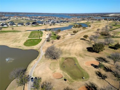 Experience resort-style living in this stunning 4-bedroom, 2 on The Golf Club at Resort Eagle Mountain Lake in Texas - for sale on GolfHomes.com, golf home, golf lot